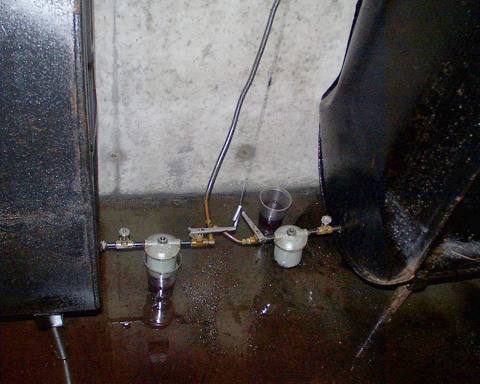 water standing under equipment on a basement floor