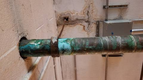 green corrosion on a copper pipe, dry