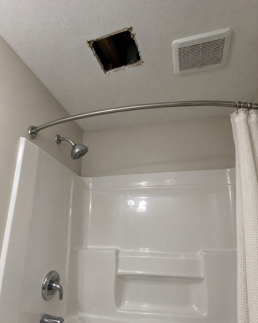 Stand-in picture: hole in a bathroom ceiling above the shower where water was dripping
