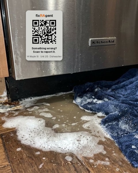 A fixRAgent sticker on the dishwasher, water on the floor below it