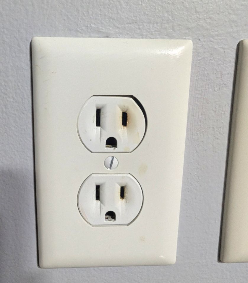 Tenant photo: a scorched electrical outlet